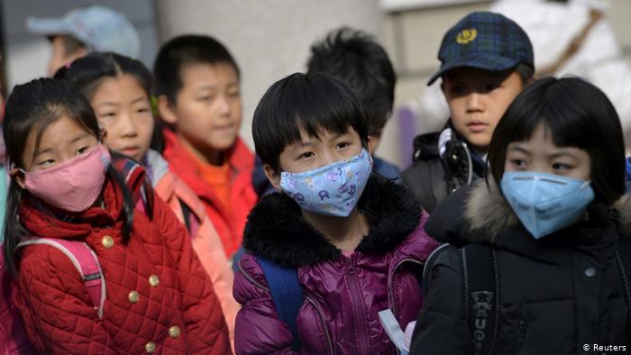 School children wear masks